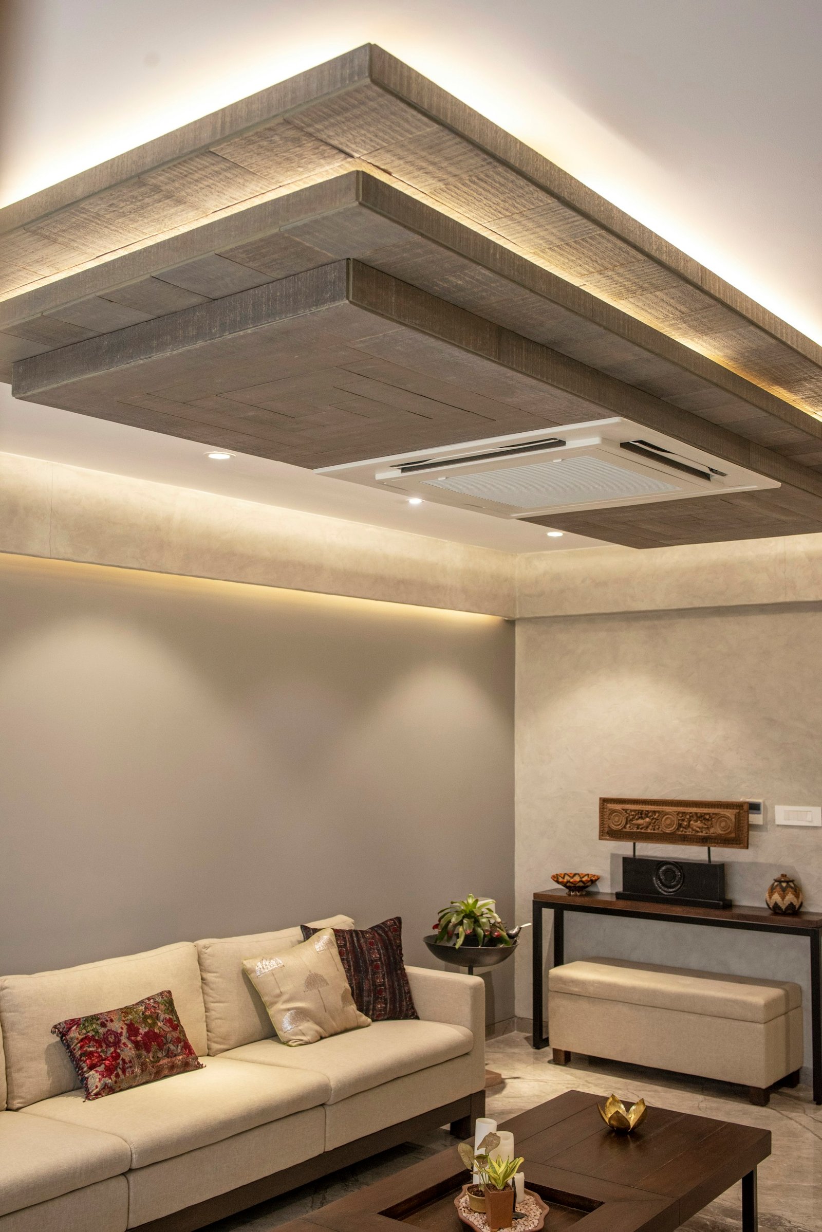 Modern living room with decorative gypsum false ceiling and lighting